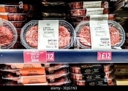 London, Epsom UK, May 29 2026, Packets of Raw British Beef Burgers Stock Photo
