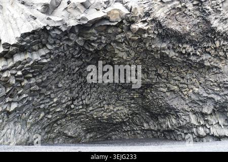 Close-up of a natural basalt sea cave ceiling showing detailed, intricate volcanic rock formations and patterns. Stock Photo