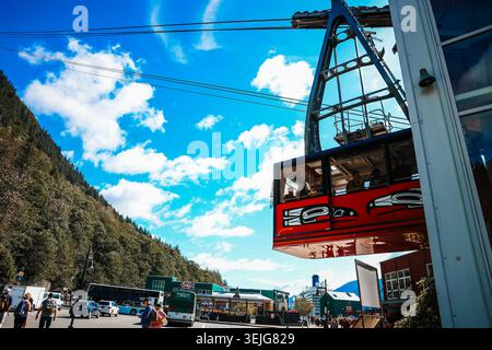 Juneau, Alaska - August 29, 2025:Goldbelt Tram Cable Car Departing Station with Cruise Port and Tour Buses Below, Juneau, Alaska Stock Photo
