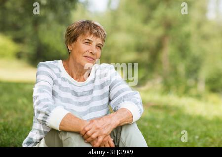 Senior woman relaxed outdoors. Stock Photo