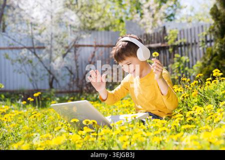 Homeschooling, distant learning. Chatting with Friends, Studying School Homework. Stock Photo