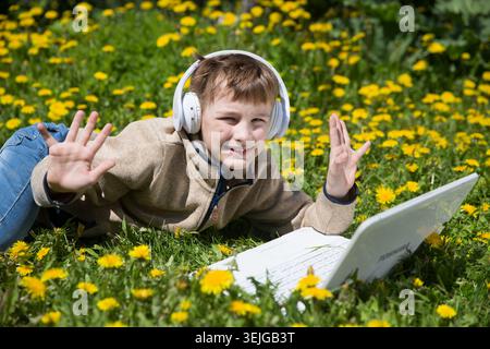 Homeschooling, distant learning. Chatting with Friends, Studying School Homework. Stock Photo