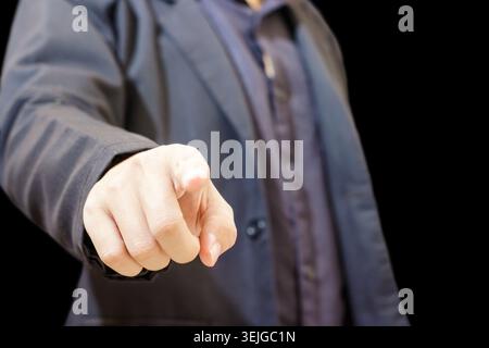 Businessman pointing finger at camera. Businessman Isolated Background. Direction Gesture. Man in Suit. High quality photo Stock Photo