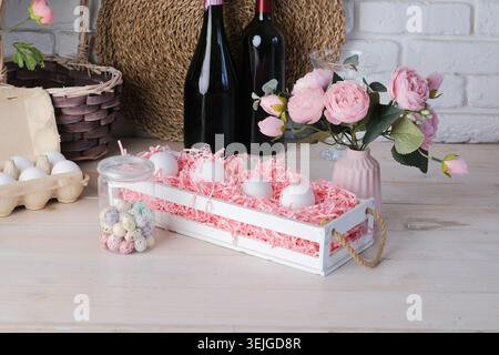 Eggs in the basket and flowers on kitchen counter decorated for Easter Stock Photo