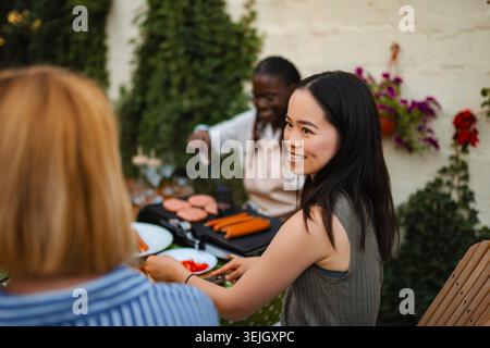 Diverse group of women enjoying outdoor barbecue party Stock Photo