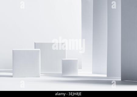 White square podiums in sunlight with shadow on white striped perspective background. Trend fashion showcase for cosmetic produc Stock Photo
