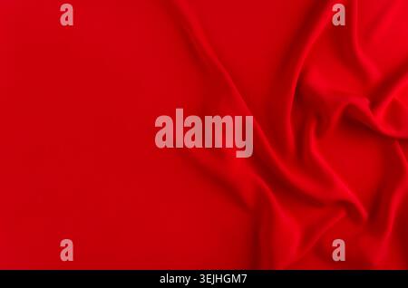 Deep red silk smooth background with copy space. Abstract love backdrop. Stock Photo