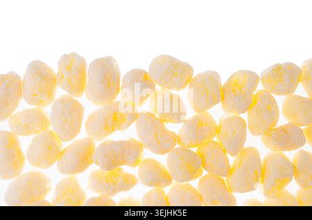 Sweet yellow corn sticks background as decorative border with copy space, isolated, top view. Stock Photo
