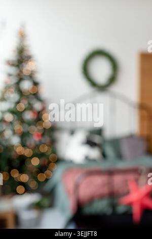 Beautiful cozy bedroom decorated for Christmas, blurred image for background Stock Photo