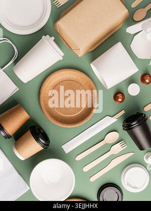 Eco friendly disposable tableware on green background Stock Photo
