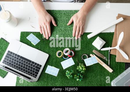 Young man teaching online making renewable energy dummy Stock Photo