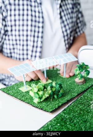 Young man making renewable energy project dummy Stock Photo