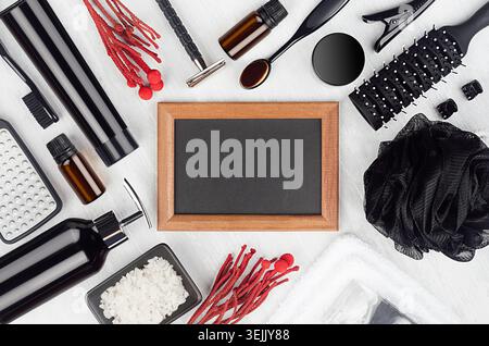 Black cosmetic, accessories for bathing, shower, shave - soap, towel, gel, puff, toothbrush, brush, salt, pumice, red sprig, pho Stock Photo