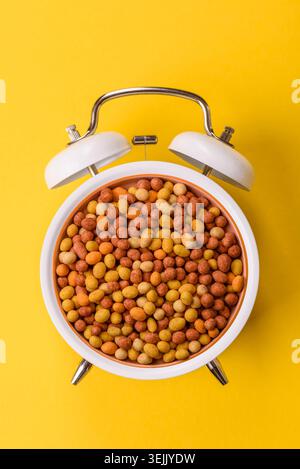 Food, nuts coated with salt and paprika, peanuts as a source of protein. Salted peanuts Stock Photo