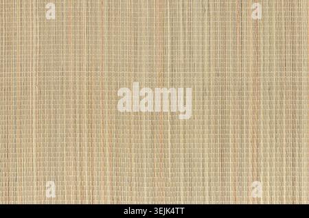 Beige natural mat of dry wicker grass as texture, background. Stock Photo