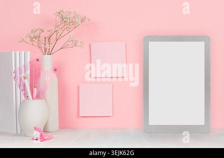 Back to school background for girl's - white stationery, blank tablet computer and stickers on soft pink wall and white wood des Stock Photo