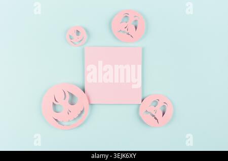Halloween template for design of cut paper - trendy pink blank square label with  funny emoji faces on pastel green background. Stock Photo