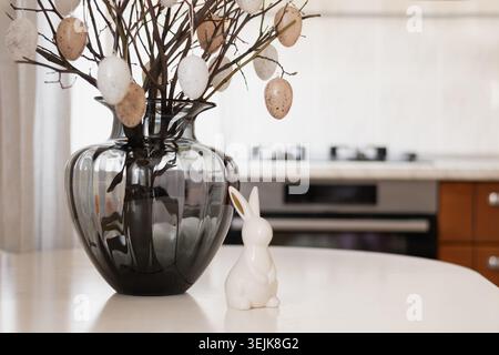 Easter branches with eggs and bunny figurine Stock Photo