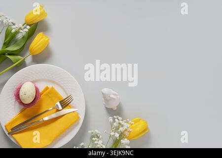 Easter plate with egg and spring flowers composition Stock Photo