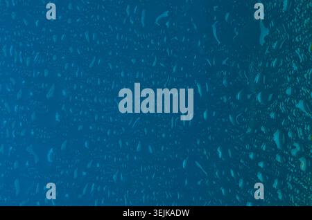 Blue water drops turquoise texture with gradient. Fresh color rain background. Stock Photo