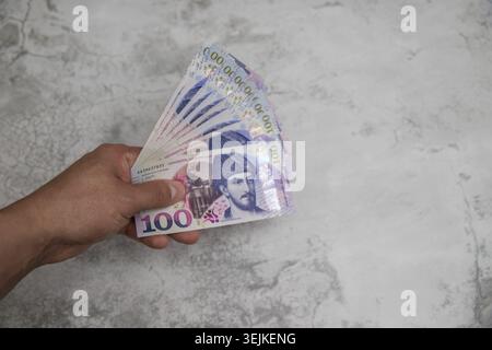 Personal finance and budgeting concept with cash money, calculator and coins on gray background Stock Photo