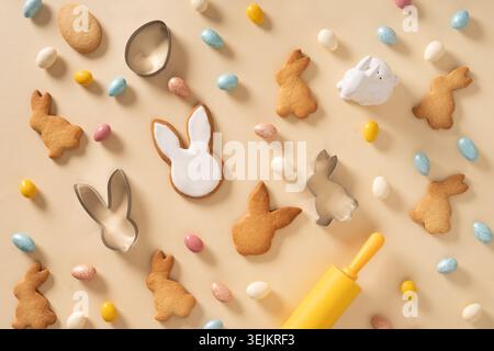 Easter bunny cookies on beige background. Top view. Stock Photo