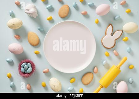 Easter cookies shaped of bunny and sweet chocolate eggs. Stock Photo