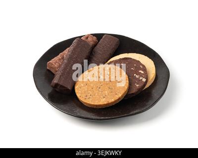 Protein bar and cookie set, different energy paleo snacks, various healthy cereal flapjacks, sport sweet breakfast on black plate, white background Stock Photo