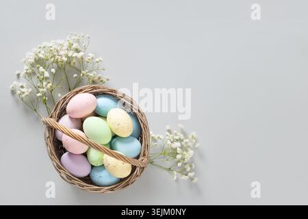 Easter pastel eggs in wicker basket for Happy holiday Stock Photo