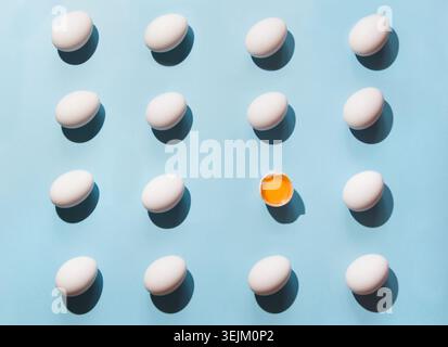 Organic white eggs on blue. Abstract pattern. Eggs in isometric. Stock Photo
