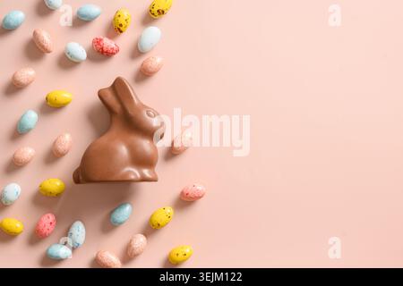 Easter mock up with pastel chocolate eggs on blue background. Stock Photo