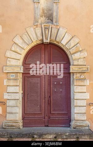Arched doorway in Pernes-les-Fontaines in Provence France Stock Photo