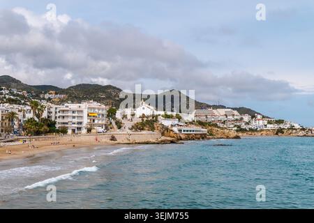 Sitges coastline with Sant Bartomeu church and Mediterranean beach in Spain Stock Photo