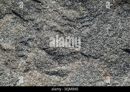 Close-up of Rough Grey Granite Rock Texture with Speckled Mineral Pattern Stock Photo
