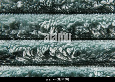 Close-up of Fluffy Light Blue Terry Cloth Fabric with Horizontal Folds Stock Photo