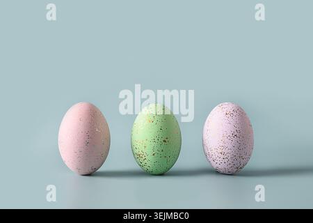 Three violet decorative pastel eggs. Happy Easter greeting card Stock Photo