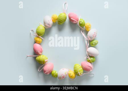 Colorful pastel easter eggs in plate as eggs. Easter greeting card. Stock Photo