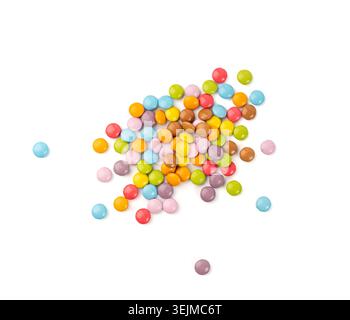 Scattered small candies isolated. Colorful dragees, multicolored glazed chocolate buttons, various dragee collection, rainbow candies on white backgro Stock Photo