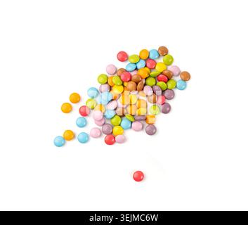 Scattered small candies isolated. Colorful dragees, multicolored glazed chocolate buttons, various dragee collection, rainbow candies on white backgro Stock Photo