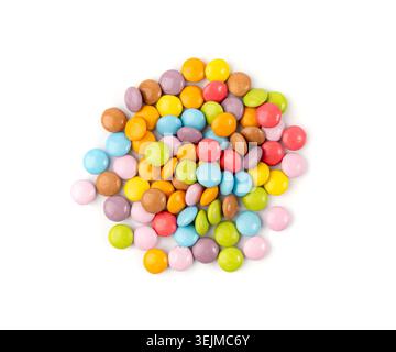 Scattered small candies isolated. Colorful dragees, multicolored glazed chocolate buttons, various dragee collection, rainbow candies on white backgro Stock Photo