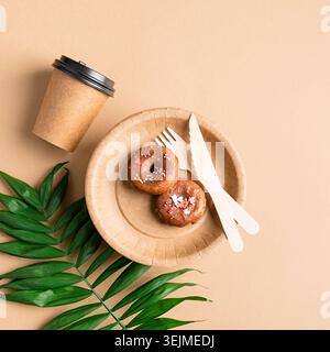 Eco friendly disposable tableware on brown background Stock Photo