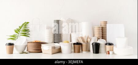 Eco friendly disposable tableware and eating utensils on table Stock Photo