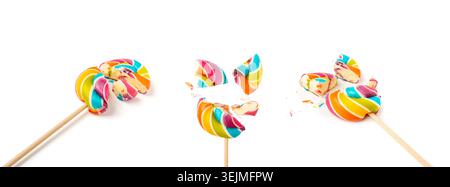 Broken color lollipops set, spiral candy on stick, colorful striped lollypop, round fruit caramel, multicolored confectionery, circle lollipop on whit Stock Photo