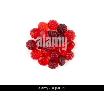 Fruit gummy candy pile isolated, vegan chewing marmalade pills, red raspberry jelly gumdrops heap, colorful gelatin candies on white background Stock Photo