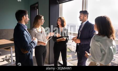 Multiethnic business group discussing strategy during meeting in office Stock Photo