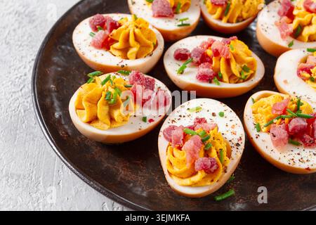 Spicy, stuffed ramen eggs, with bacon and green onions, homemade, no people, Stock Photo