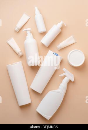 Group of white blank packaging tubes and containers for cosmetics on beige natural color background, mockup design, eco friendly Stock Photo