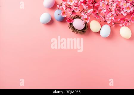 Easter holiday background with decorations on pink backdrop Stock Photo