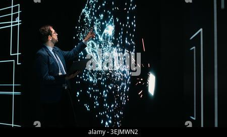 Researcher optimizes AI deep learning model by adjusting parameters using AR technology. Tech startup software developer projecting neural network architecture to modify datasets Stock Photo