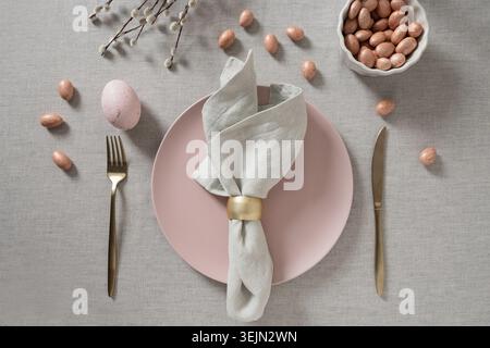Easter table setting with pink egg and willow branches Stock Photo